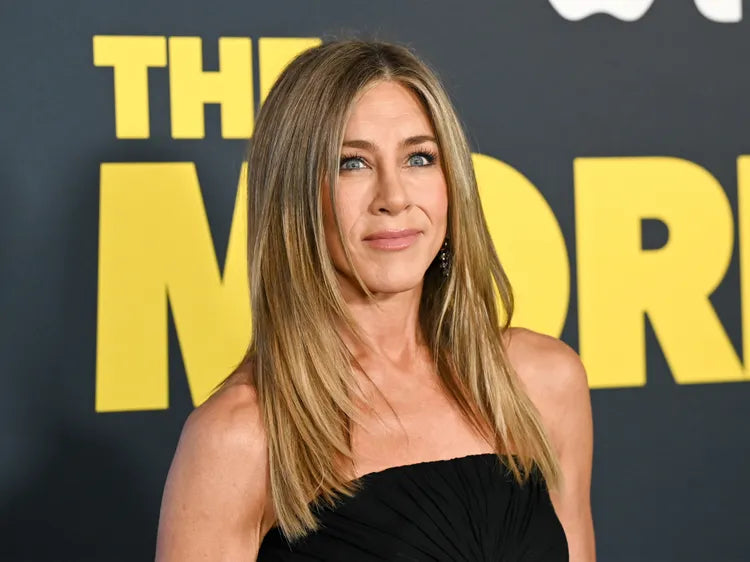 I’m Buying These 18 Jennifer Aniston–Approved Gifts From $3: Butt-Flattering Levi’s, Comfy New Balances, and More